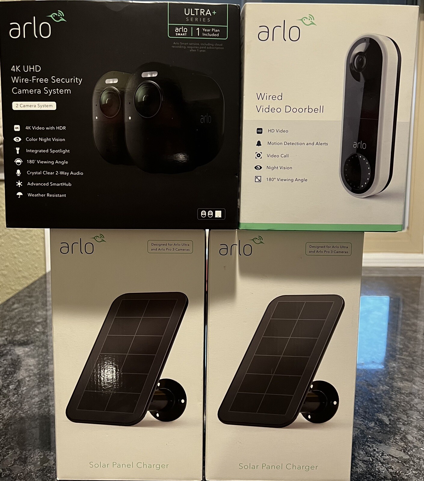 2 Arlo ultra 4k uhd wire-free security camera, 2 Solar Panels, 1 Wired Doorbell