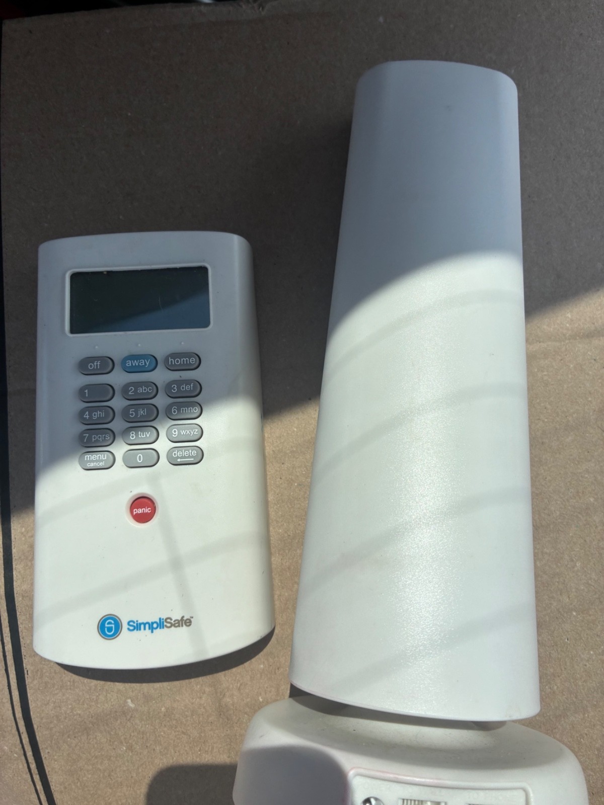 SimpliSafe Security System Kit – See Details. Console and Remote.