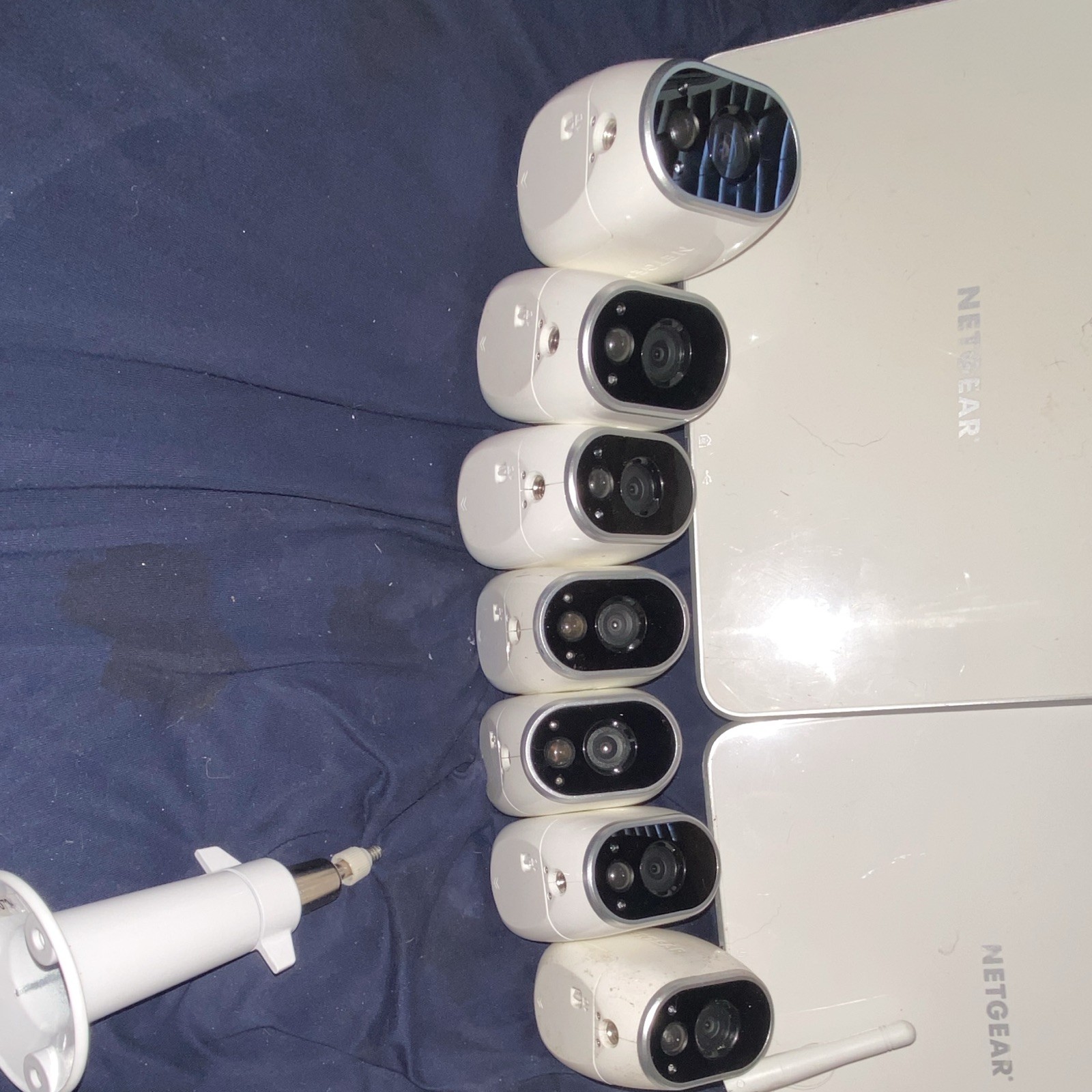 Arlo security cameras W/ 2 base stations and Wi-Fi extender. 5 magnet wall mount