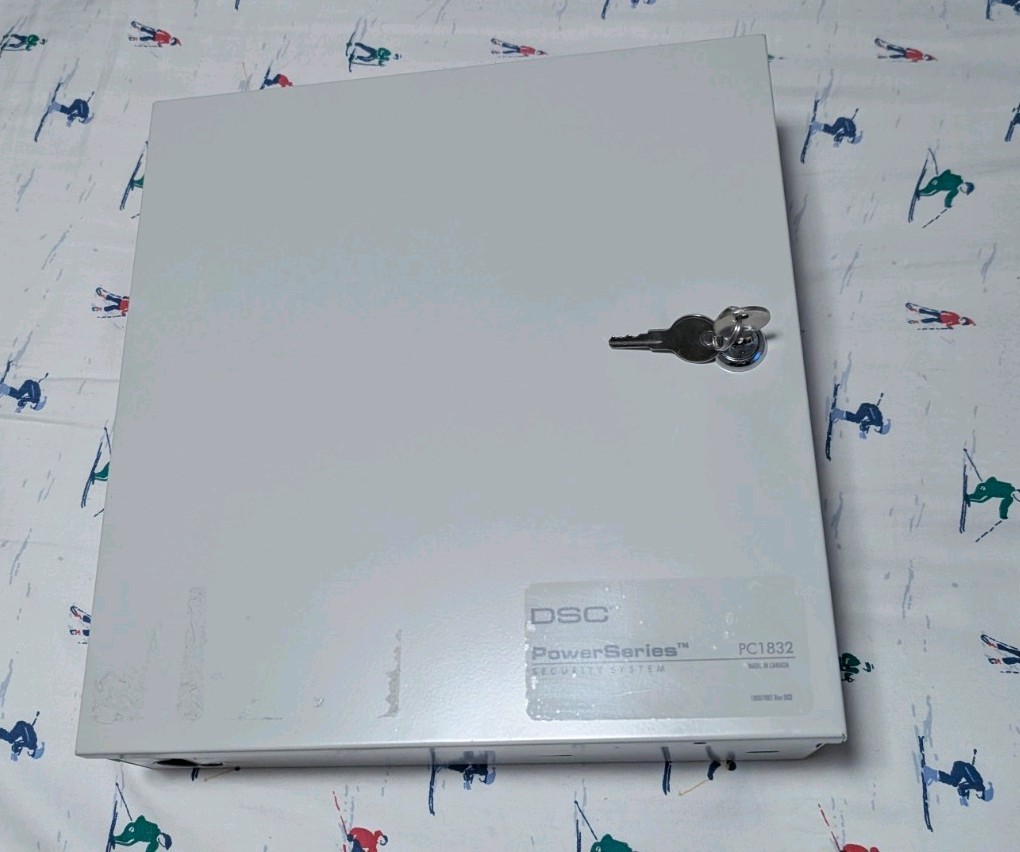 DSC PC1832 PowerSeries 8-32 Zone Alarm System Board with housing and keypads