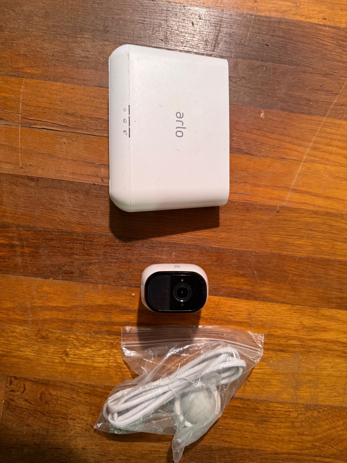 Arlo Pro VMB4000 base station, one Arlo Pro Camera, cables and camera mount.